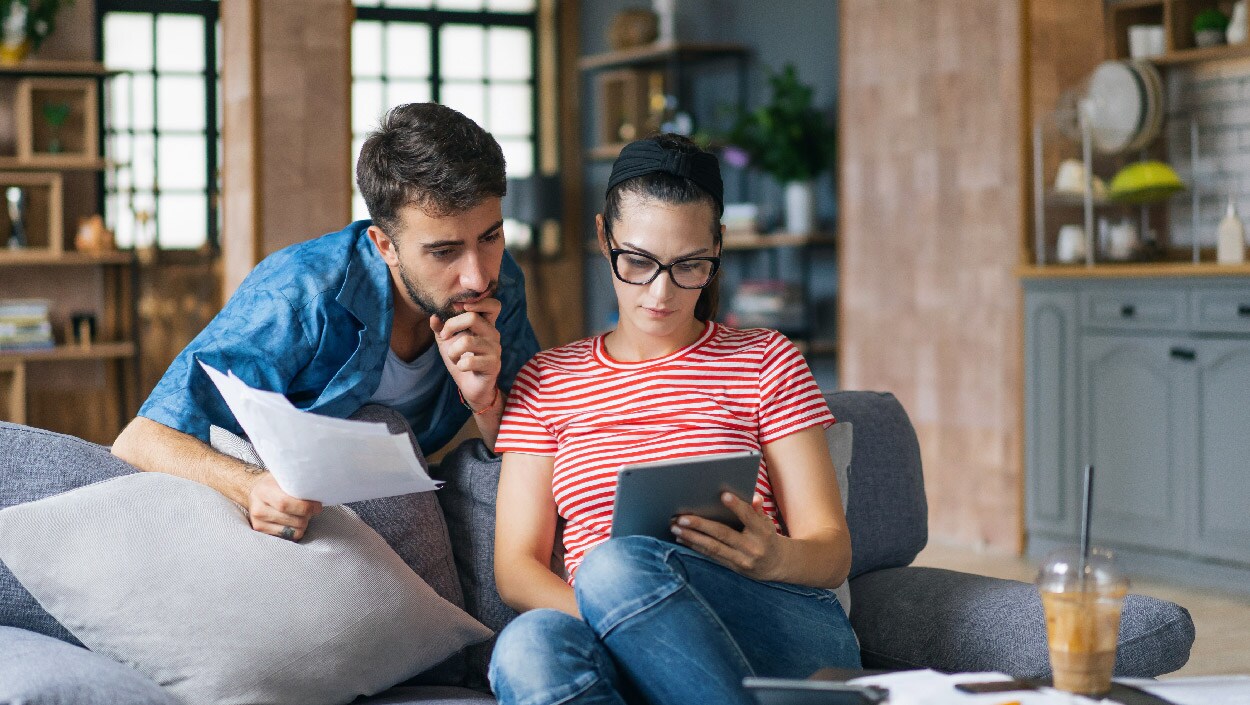 Two people looking at a tablet